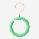 Round scarf and belt hook from Flying Tiger Copenhagen, mounted on a wall for home organization.