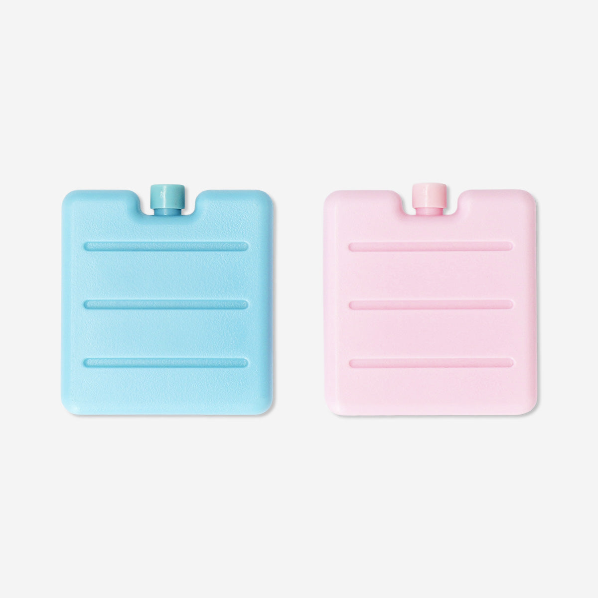 Two colorful blue and pink ice blocks for home use, branded Flying Tiger Copenhagen, shown in the image.