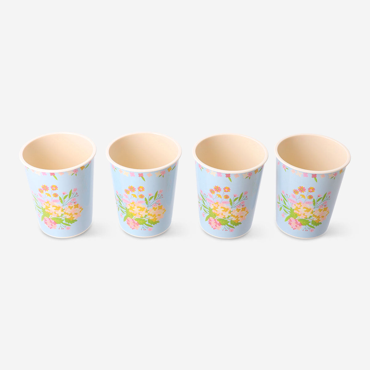 Set of four reusable floral party cups by Flying Tiger Copenhagen, colorful and eco-friendly for celebrations.