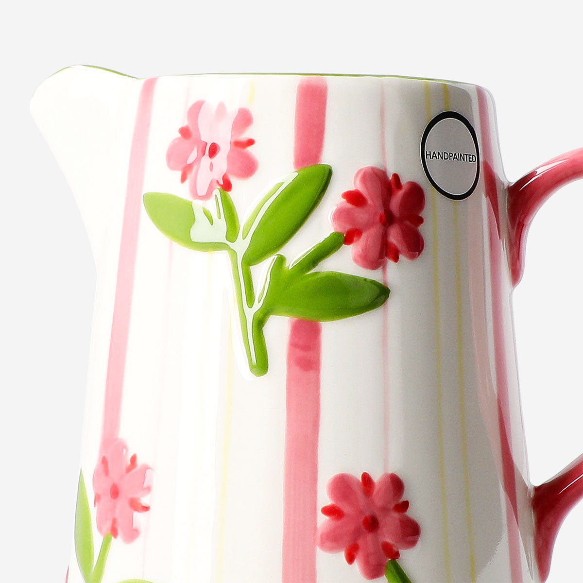 1L Flying Tiger Copenhagen ceramic jug with hand-painted stripes and floral design, featuring a colorful, artistic kitchen accessory.