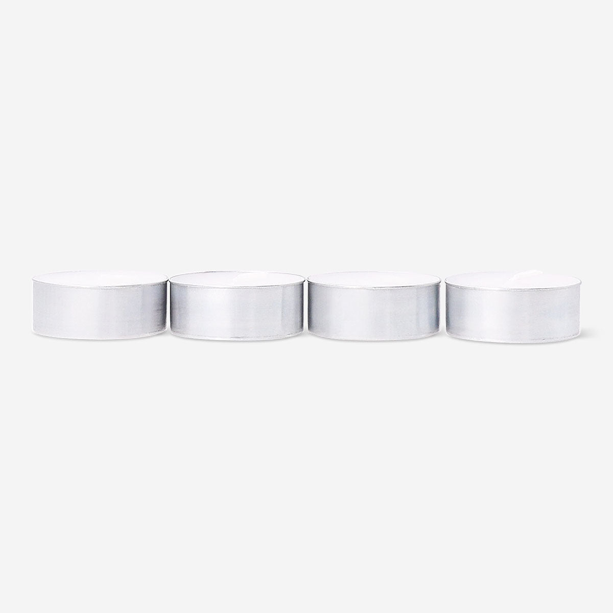 Set of four Flying Tiger Copenhagen scented tealights with forest fragrance, ideal for home decor and ambiance.