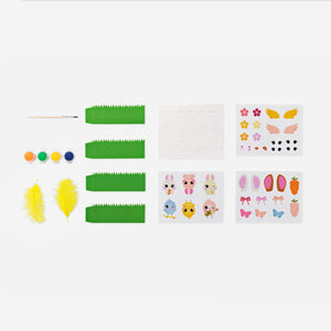Colorful Easter egg decoration kit for hobbies by Flying Tiger Copenhagen, includes various paints and accessories for decorating eggs.