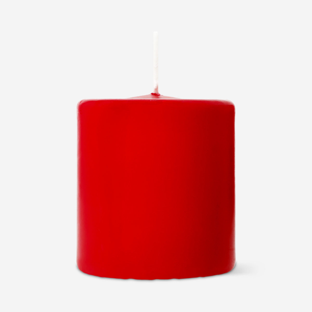 Red pillar candle from Flying Tiger Copenhagen, 8 cm tall, suitable for home decor, with a smooth, cylindrical shape.