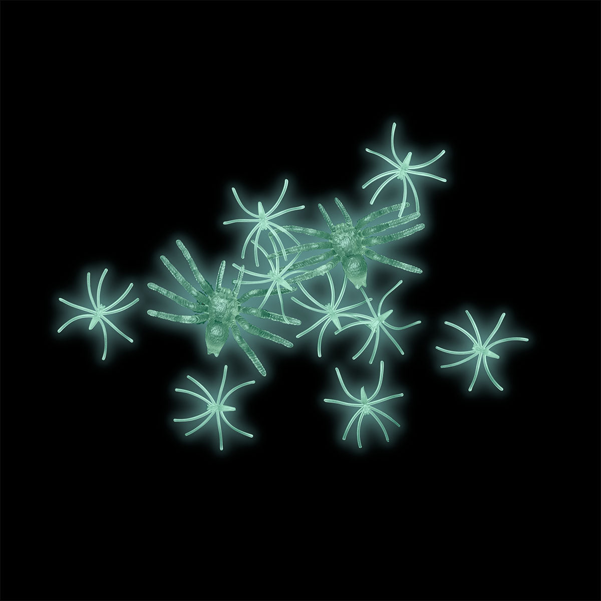 Set of 12 glow-in-the-dark spiders for party decorations, Flying Tiger Copenhagen. Black plastic spiders with luminous features.