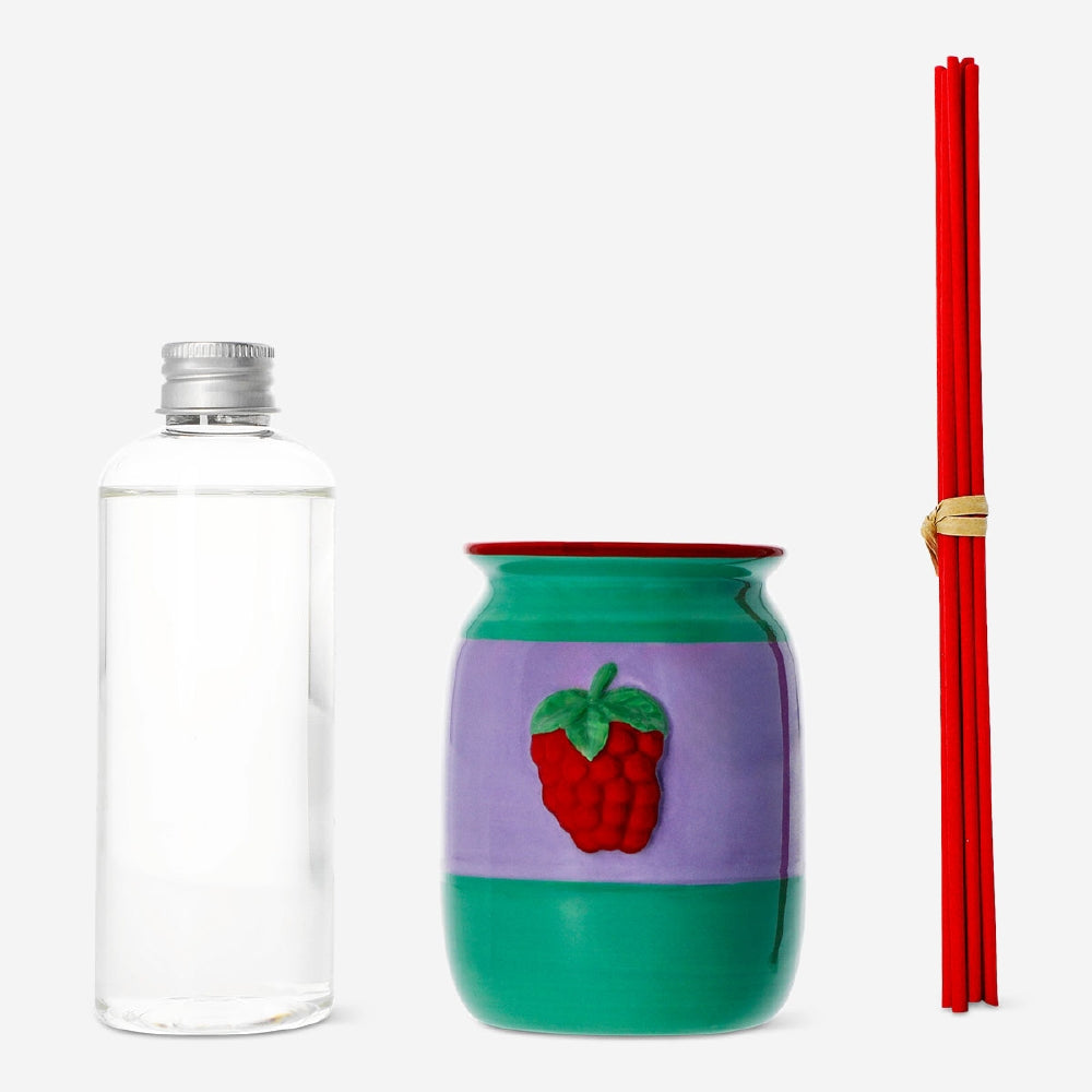 Flying Tiger Copenhagen raspberry scented reed diffuser in a 200ml glass bottle, designed to add a fresh fragrance to home decor.