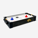 Flying Tiger Copenhagen air hockey arcade game with a colorful playing surface and two paddles on the table.