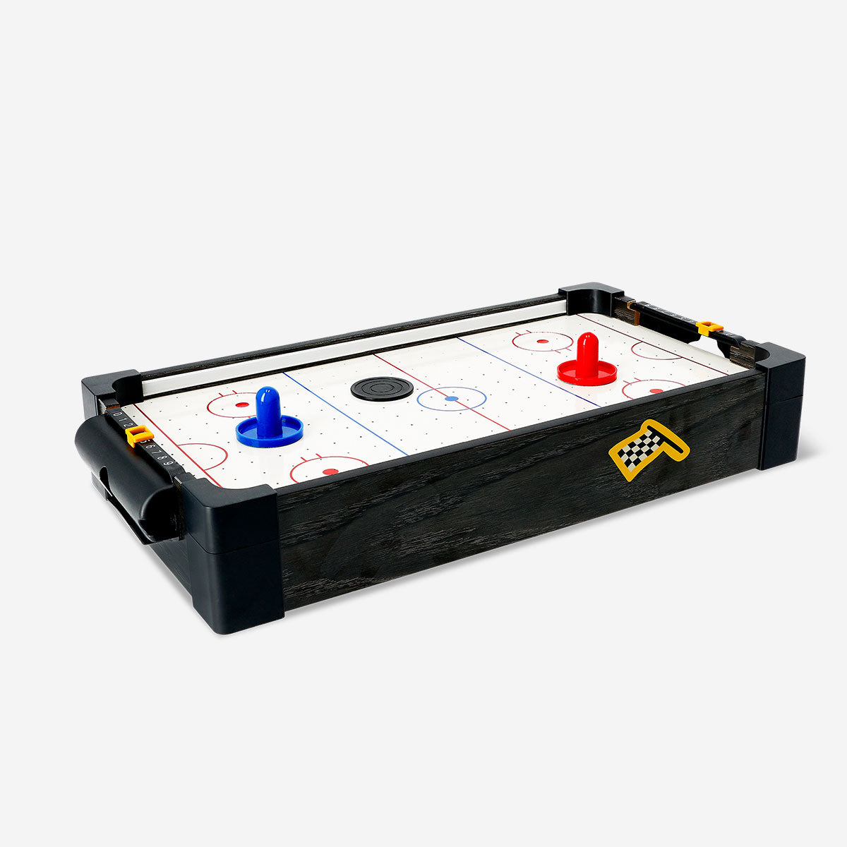 Flying Tiger Copenhagen air hockey arcade game with a colorful playing surface and two paddles on the table.