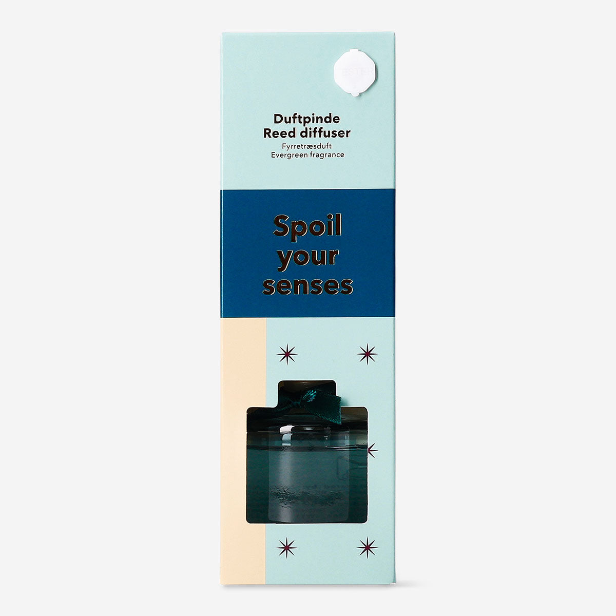 Flying Tiger Copenhagen evergreen reed diffuser for home, with glass bottle and natural reed sticks in a cozy setting.