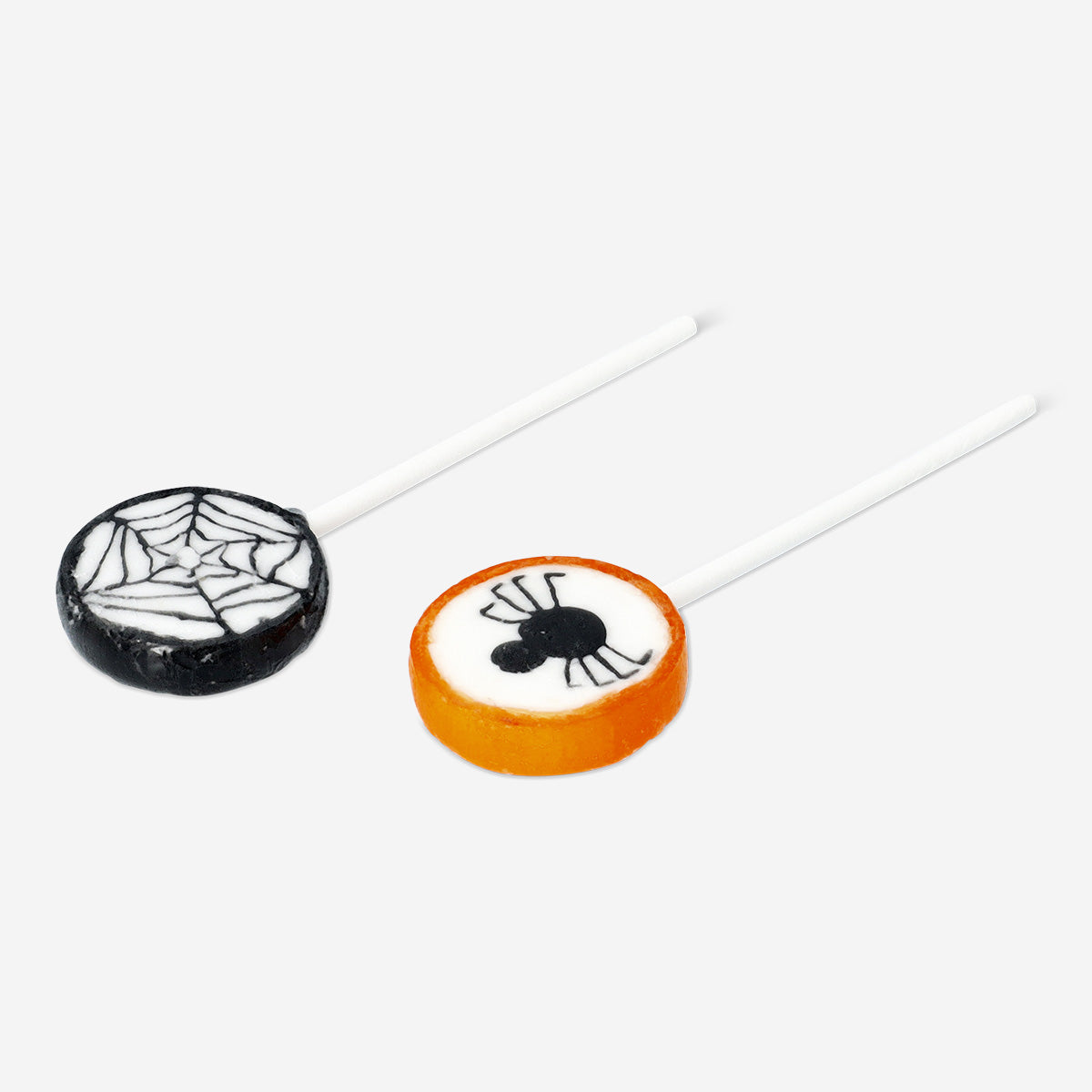 Assorted orange and blackcurrant flavored lollipops in colorful wrappers, from Flying Tiger Copenhagen.