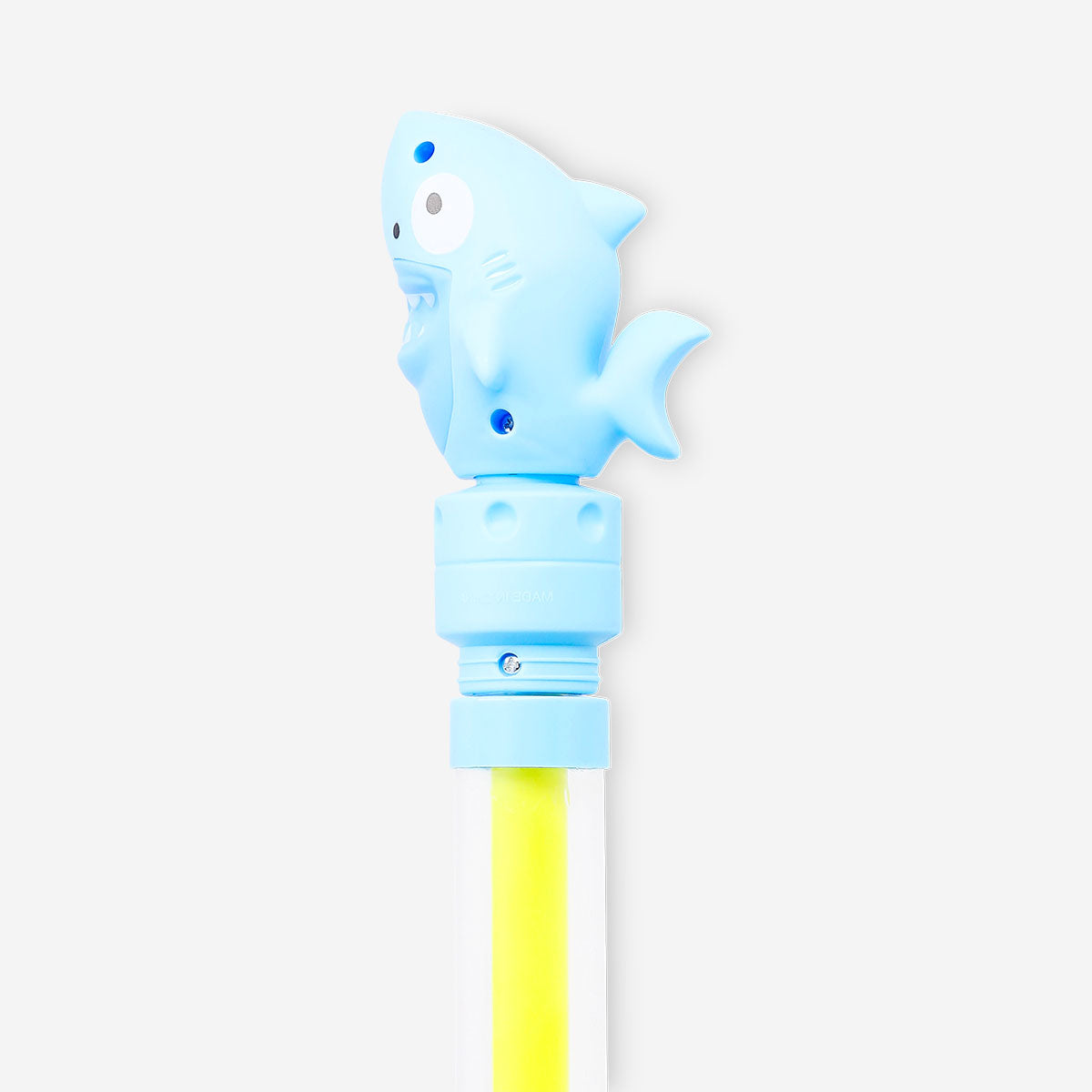 Toy water pump featuring a fun shark decoration from Flying Tiger Copenhagen, perfect for kids' play and water activities.