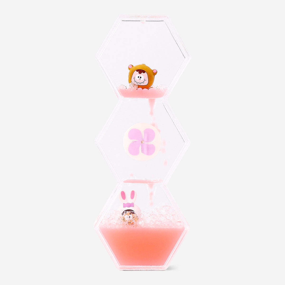 Decorative hourglass gadget with candy monster icons, featuring clear glass and colorful playful design from Flying Tiger Copenhagen.
