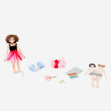 DIY fashion designer kit by Flying Tiger Copenhagen with colorful fabric swatches, tools, and accessories for creative fashion projects.