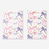 Two office gift bags with colorful bows from Flying Tiger Copenhagen, featuring festive paper design and sturdy handles.