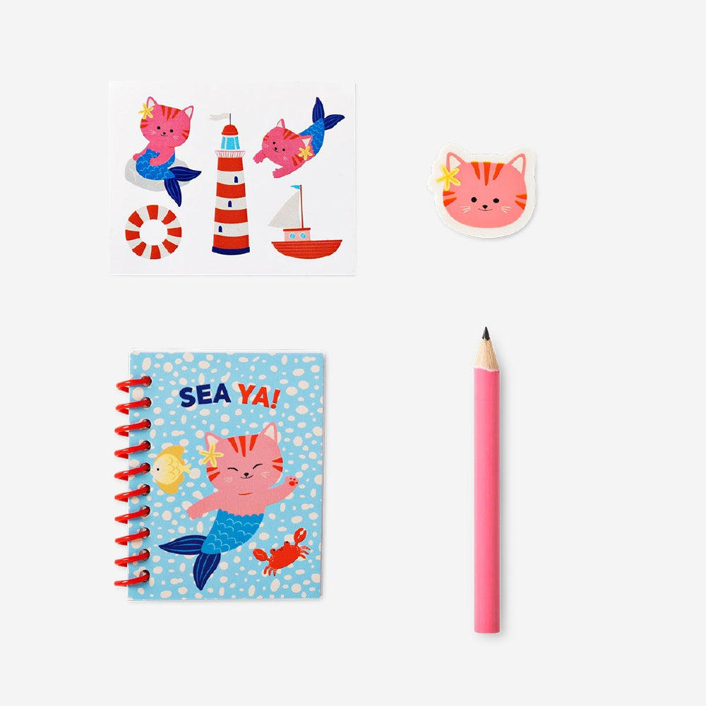 Colorful stationery kit in a cat-themed backpack from Flying Tiger Copenhagen, ideal for office and school supplies.