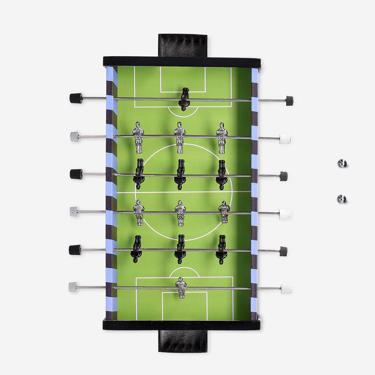 Mini football game by Flying Tiger Copenhagen featuring a small tabletop soccer setup with colorful players and a goal.