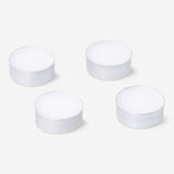 Set of four Flying Tiger Copenhagen scented tealights with forest fragrance, ideal for home ambiance and decoration.