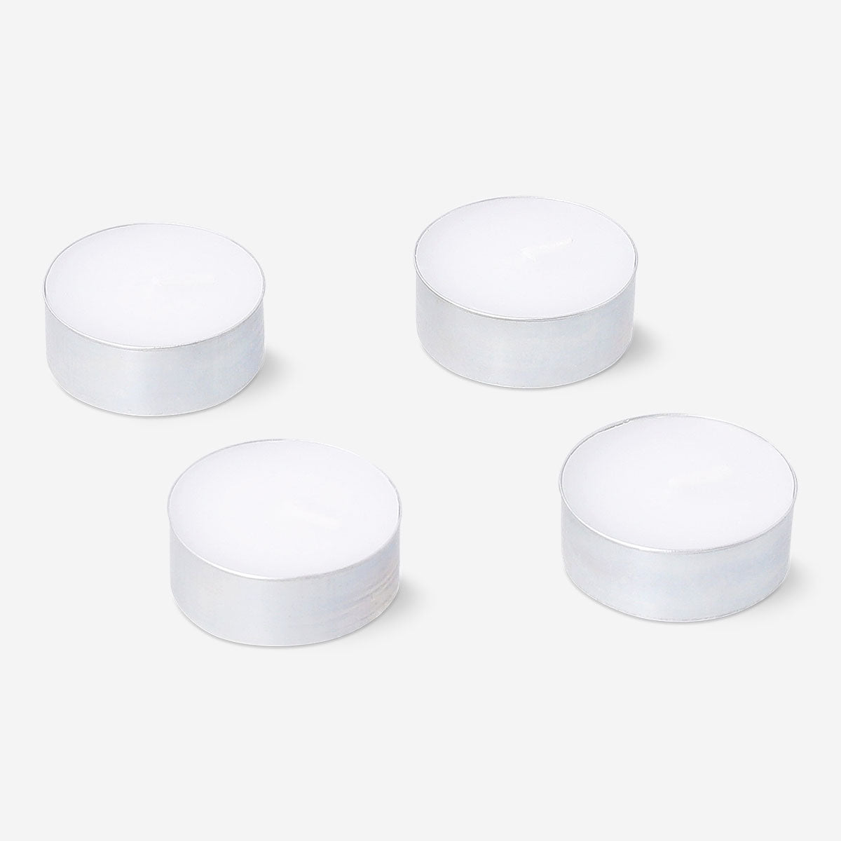 Set of four Flying Tiger Copenhagen scented tealights with forest fragrance, ideal for home ambiance and decoration.