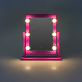 Pink wall mirror with light from Flying Tiger Copenhagen, 41x37 cm, featuring a RuPaul's Drag Race collaboration design.