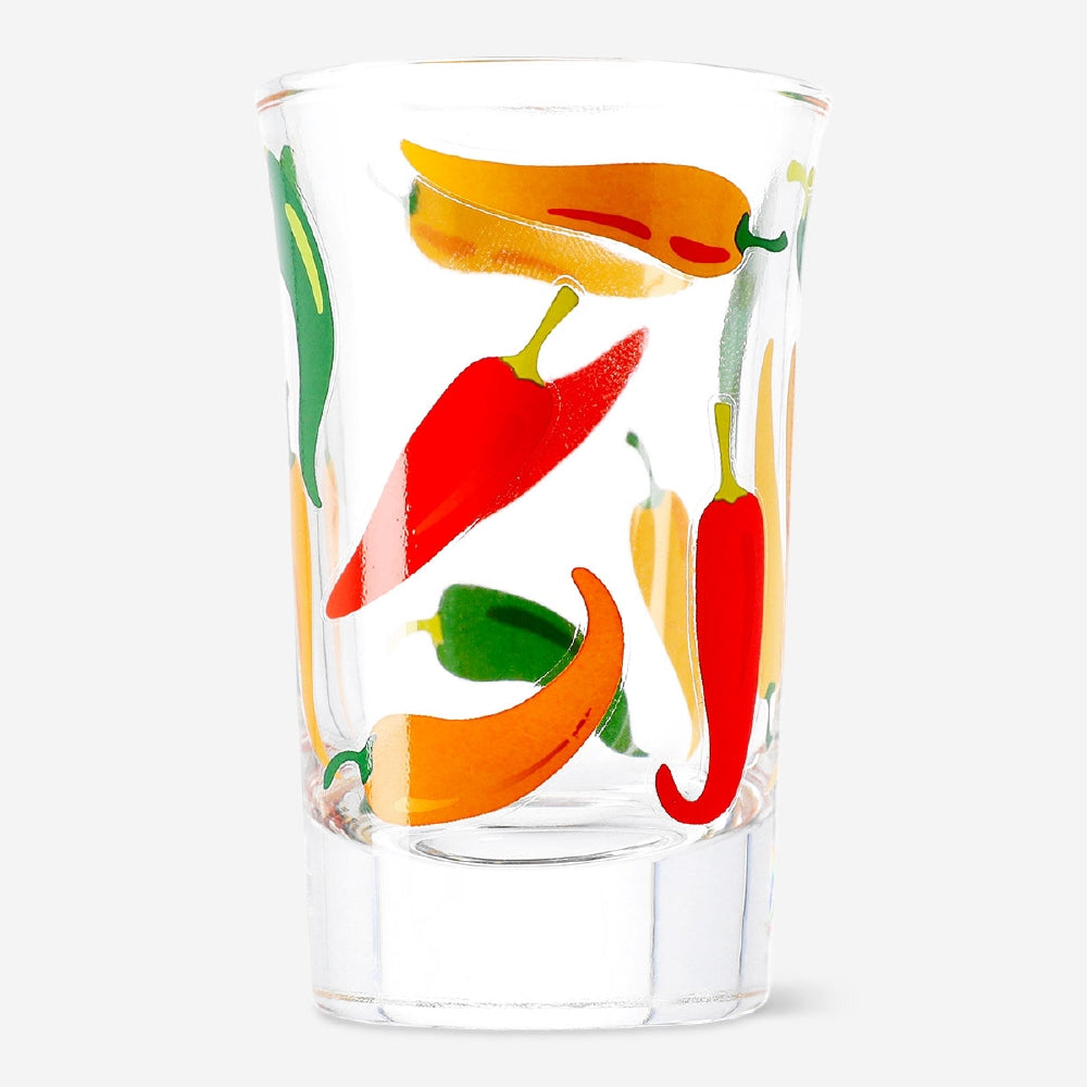 Small 40ml shot glass with chili print, made by Flying Tiger Copenhagen, featuring a colorful chili design on clear glass.