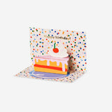 Flying Tiger Copenhagen birthday card featuring a colorful pop-up cake slice design for office celebrations.