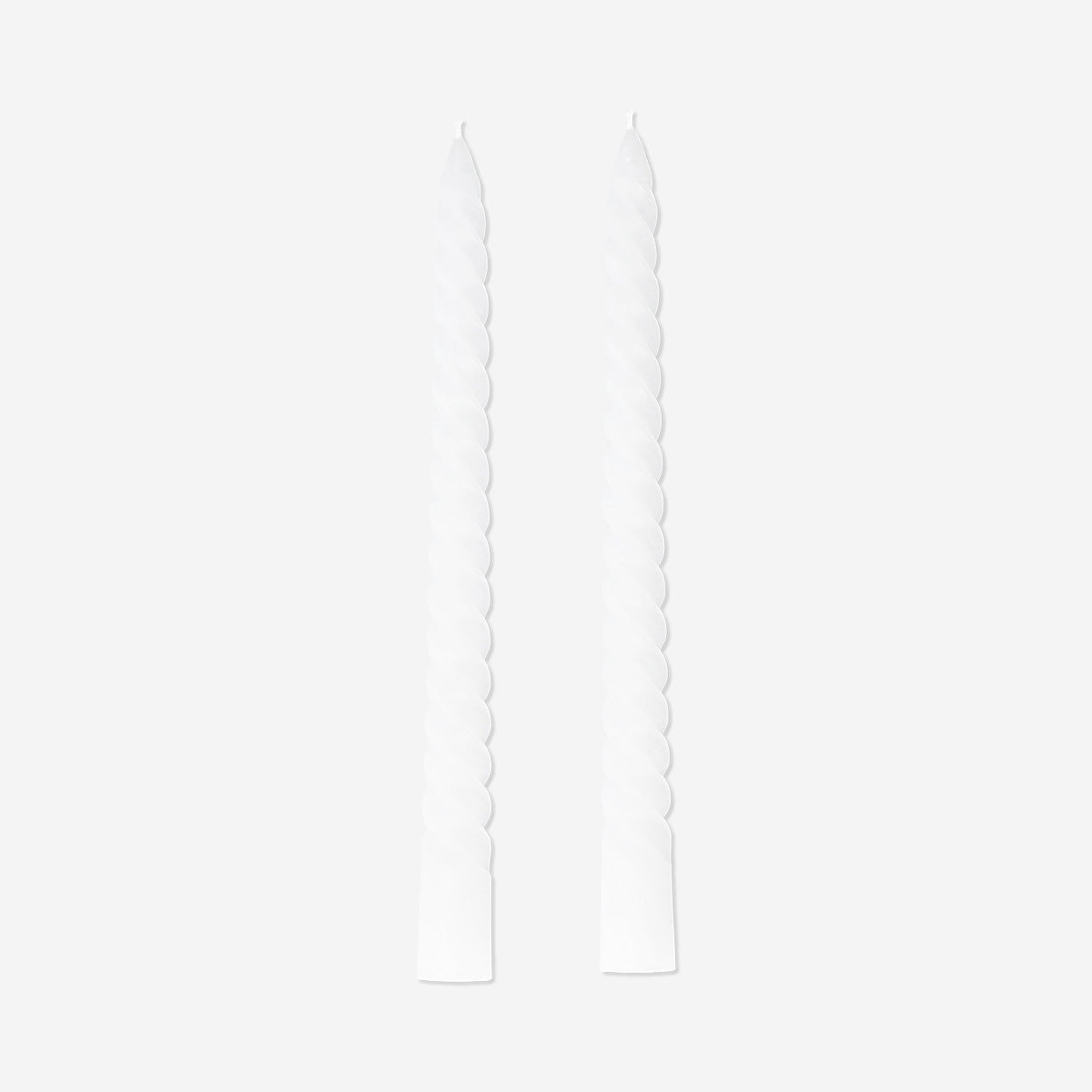 Set of four white twisted dinner candles for home decor, crafted by Flying Tiger Copenhagen.