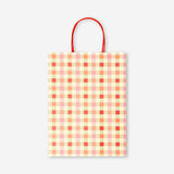 Checkered gift bag from Flying Tiger Copenhagen, 25x33 cm, with a stylish check pattern and sturdy handles for office gifts.