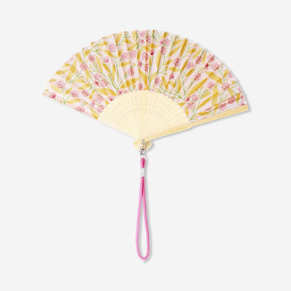 Foldable bamboo fan with flower print and strap, textile accessory by Flying Tiger Copenhagen, designed for portable cooling and style.