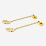 Set of two gold dessert spoons with sunflower toppers, stylish kitchen utensils by Flying Tiger Copenhagen.