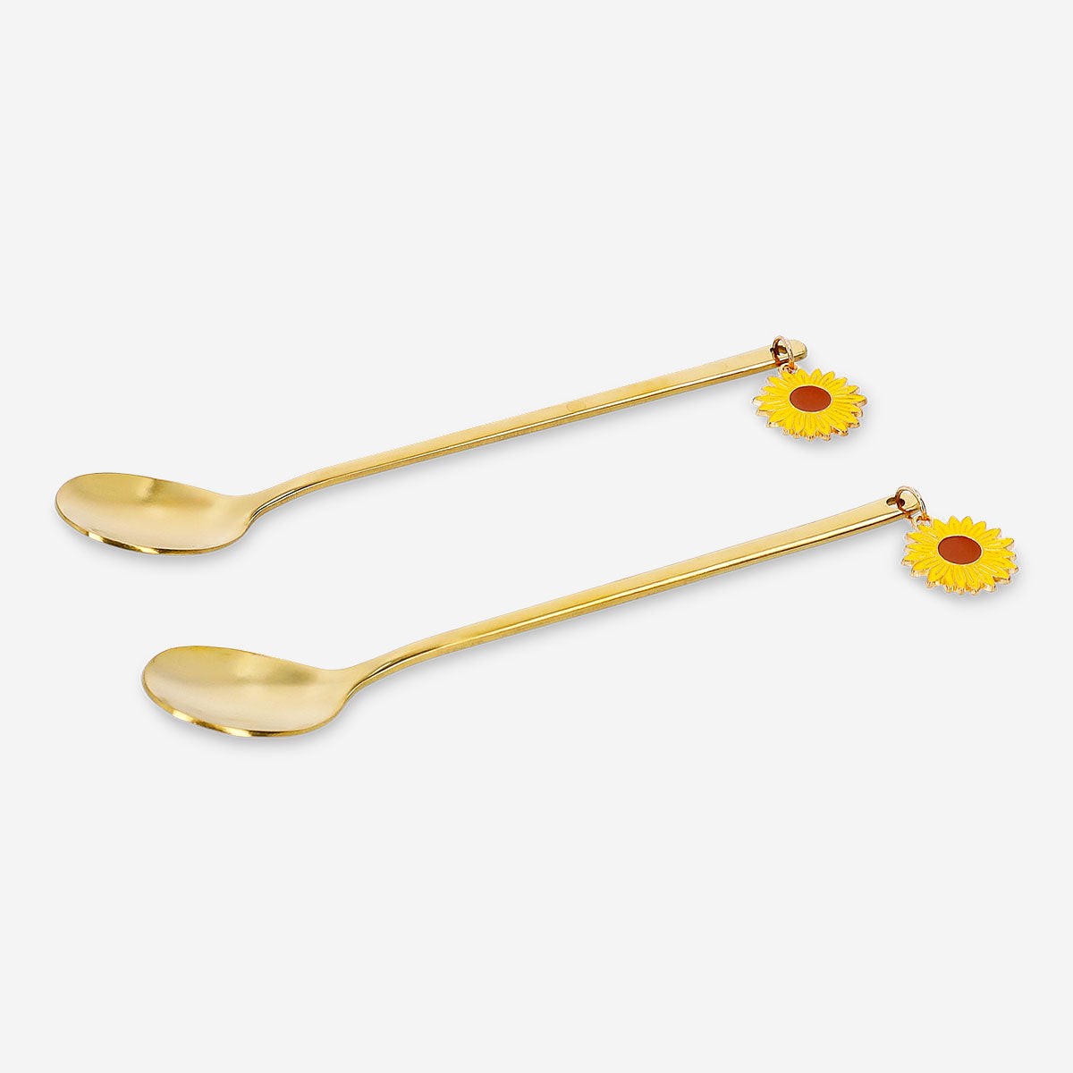 Set of two gold dessert spoons with sunflower toppers, stylish kitchen utensils by Flying Tiger Copenhagen.
