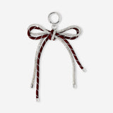 Flying Tiger Copenhagen glitter bow keyring made of textile with a sparkling bow design on a metal keyring.