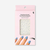 Flying Tiger Copenhagen nail decorating kit with colorful rhinestones for creative personal care and nail art.