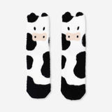 Flying Tiger Copenhagen Comfy Cow socks in size 39/40, soft textile with cow print pattern on a white background.