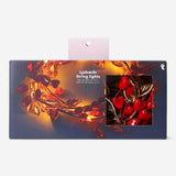 String lights with red berries and gold leaves, decorative home lighting from Flying Tiger Copenhagen.
