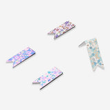 Set of four floral magnetic bookmarks by Flying Tiger Copenhagen, colorful and decorative office accessories for marking pages.
