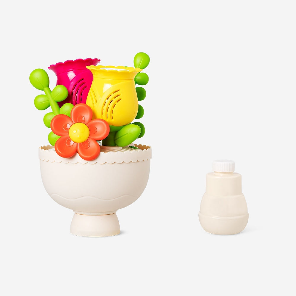 Flying Tiger Copenhagen soap bubble machine toy with colorful flower-shaped bubbles and a playful design.