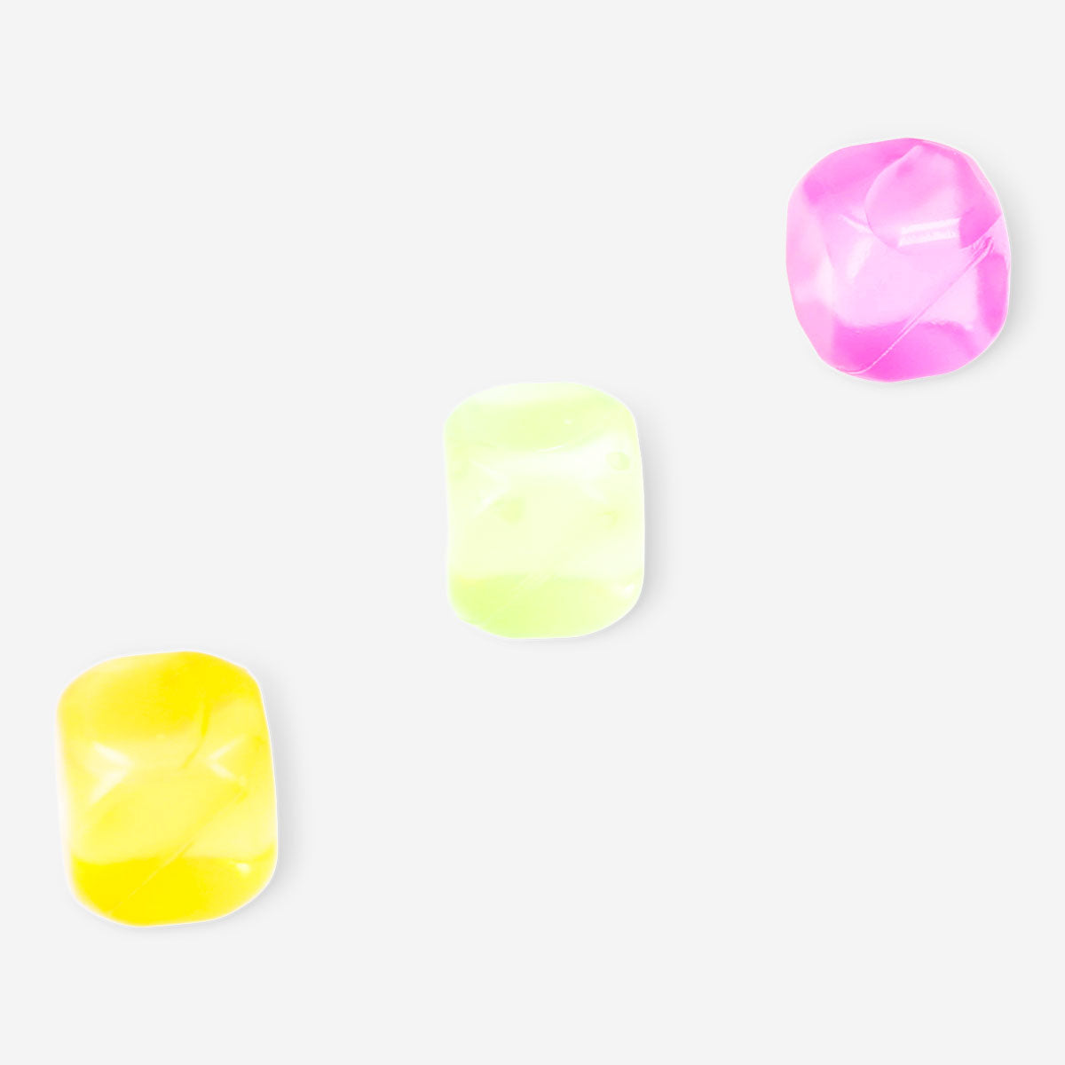 Six reusable ice cubes from Flying Tiger Copenhagen in a clear container, designed for cooling drinks without melting.