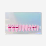 Flying Tiger Copenhagen pink cherry press-on nails for personal care, showcasing vibrant cherry design on short, stylish artificial nails.