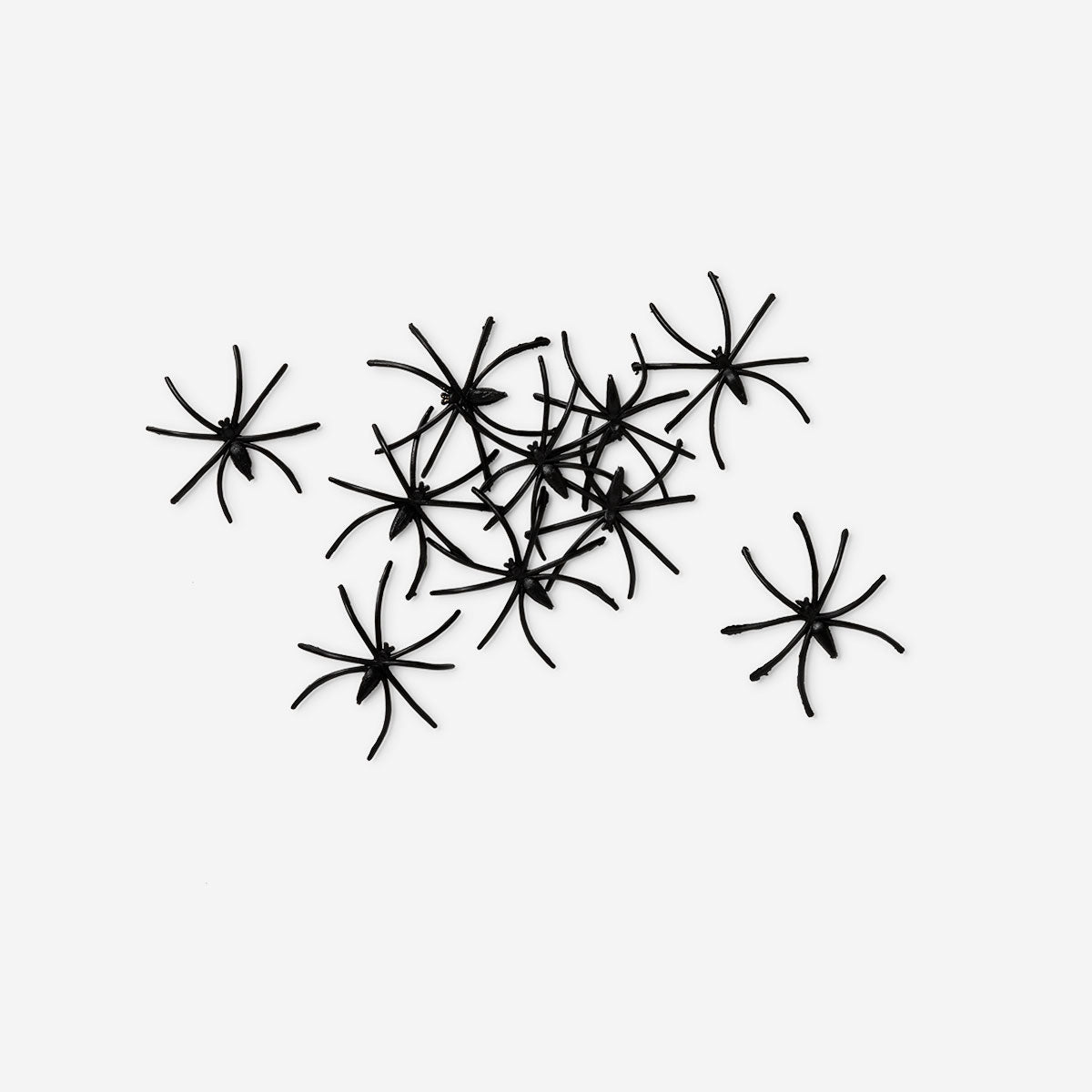 Set of 20 small decorative spiders for party decoration, Flying Tiger Copenhagen, featuring black plastic spider figures.
