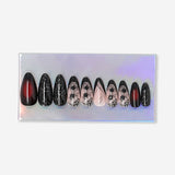 Flying Tiger Copenhagen press-on nails with black and red ombre design showcasing glossy, stylish nail art.