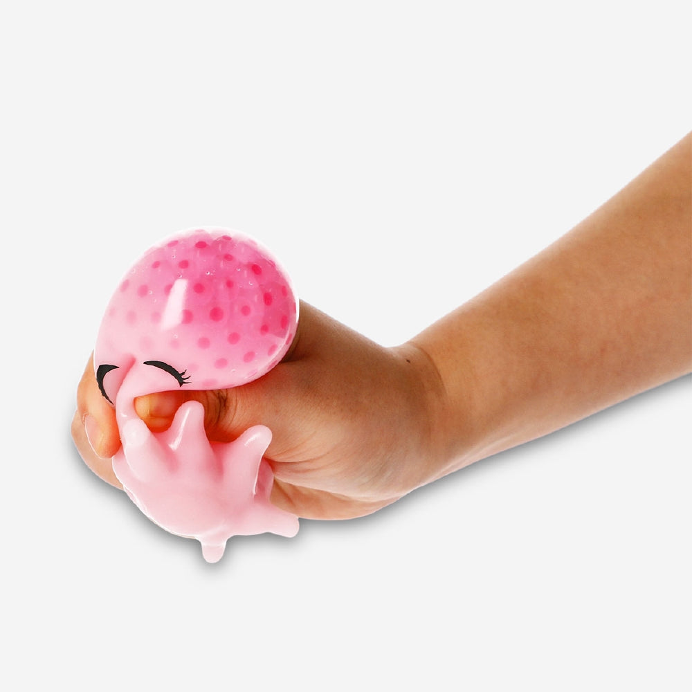 Pink octopus press me toy gadget by Flying Tiger Copenhagen, soft silicone body with multiple tentacles for squeezing fun.
