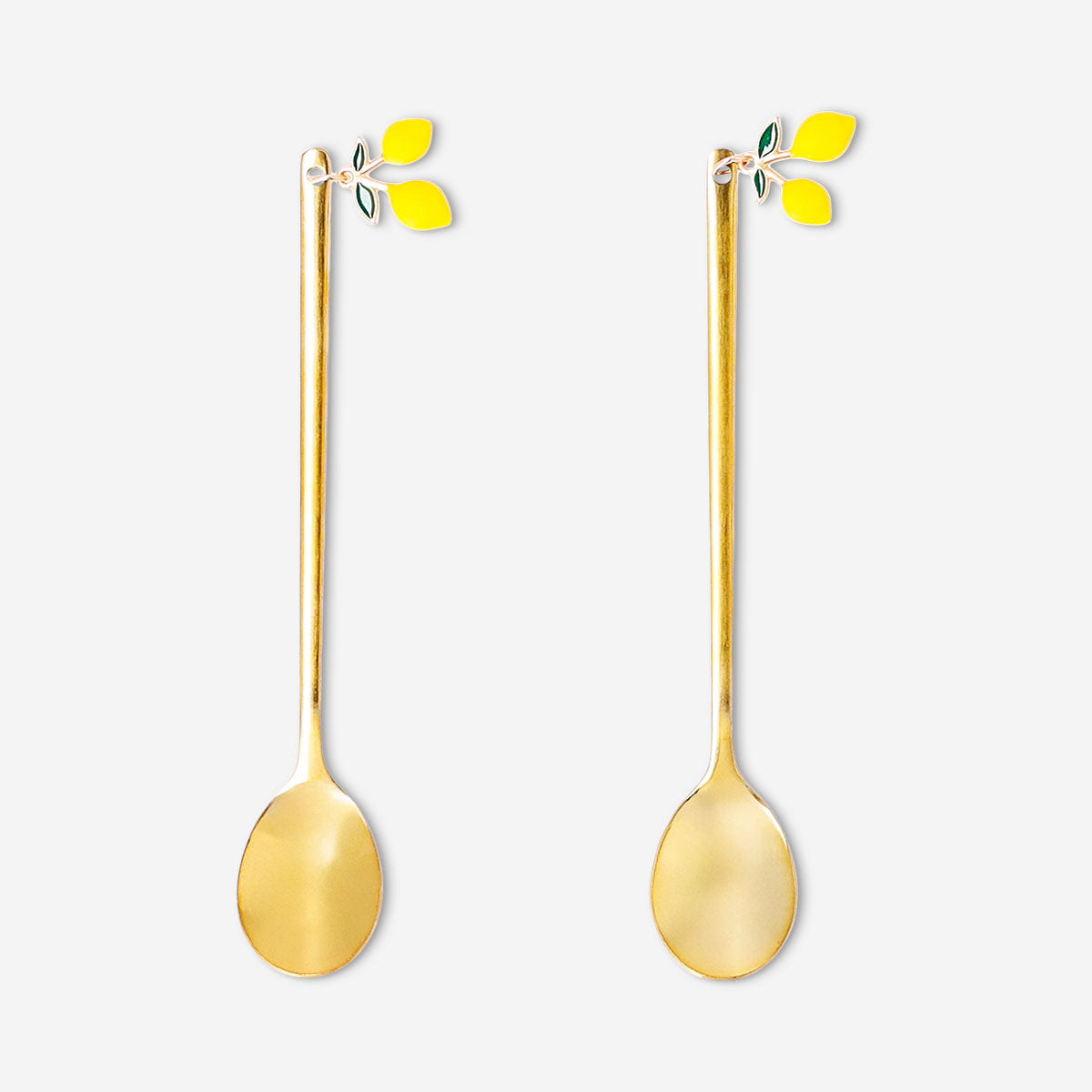 Set of two gold dessert spoons with lemon decoration from Flying Tiger Copenhagen, perfect for elegant serving.