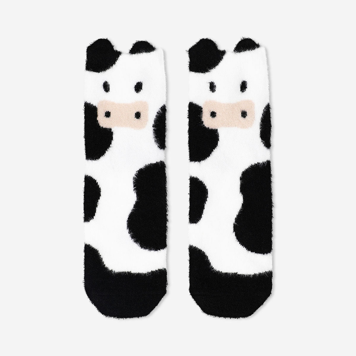 Flying Tiger Copenhagen Comfy Cow socks in size 37/38, soft textile with cow pattern and cozy fit.
