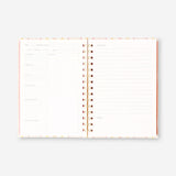 Office recipe book by Flying Tiger Copenhagen featuring colorful pages and culinary ideas for workplace cooking and snacks.