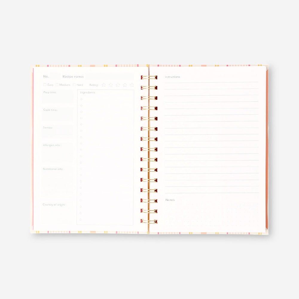Office recipe book by Flying Tiger Copenhagen featuring colorful pages and culinary ideas for workplace cooking and snacks.