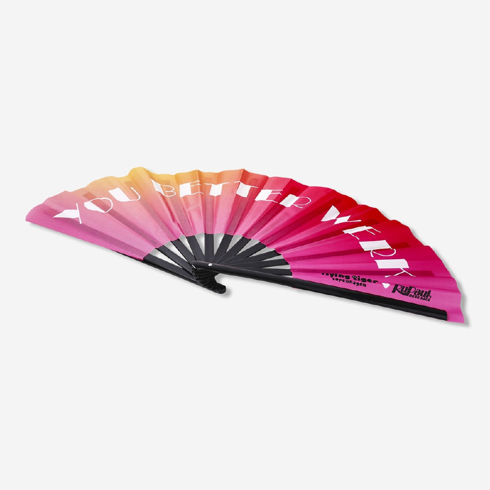 Flying Tiger Copenhagen Clack fan with strap featuring colorful textile design, compact and portable for on-the-go cooling.