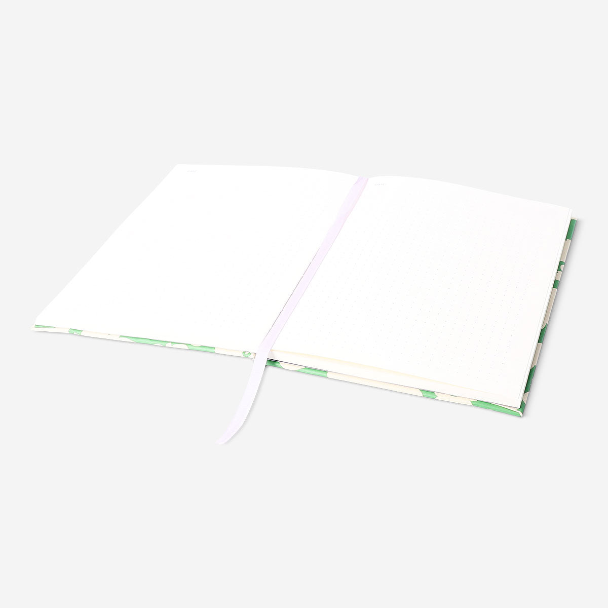 A5 green floral bullet planner from Flying Tiger Copenhagen with a vibrant floral cover and organized interior pages.