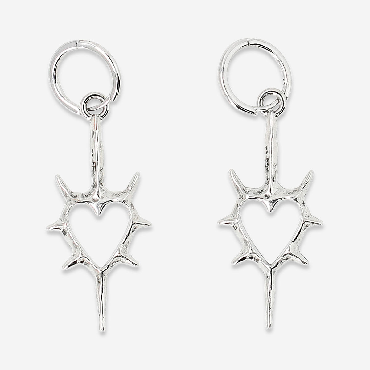 Silver spiky heart textile hanging earrings with intricate details, featuring a modern, edgy design from Flying Tiger Copenhagen.