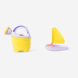 Flying Tiger Copenhagen clamshell sandbox with colorful sand molds, perfect for outdoor play and sandcastle building.