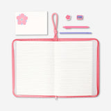 Floral stationery kit from Flying Tiger Copenhagen featuring colorful notepads, pens, and decorative paper for office use.