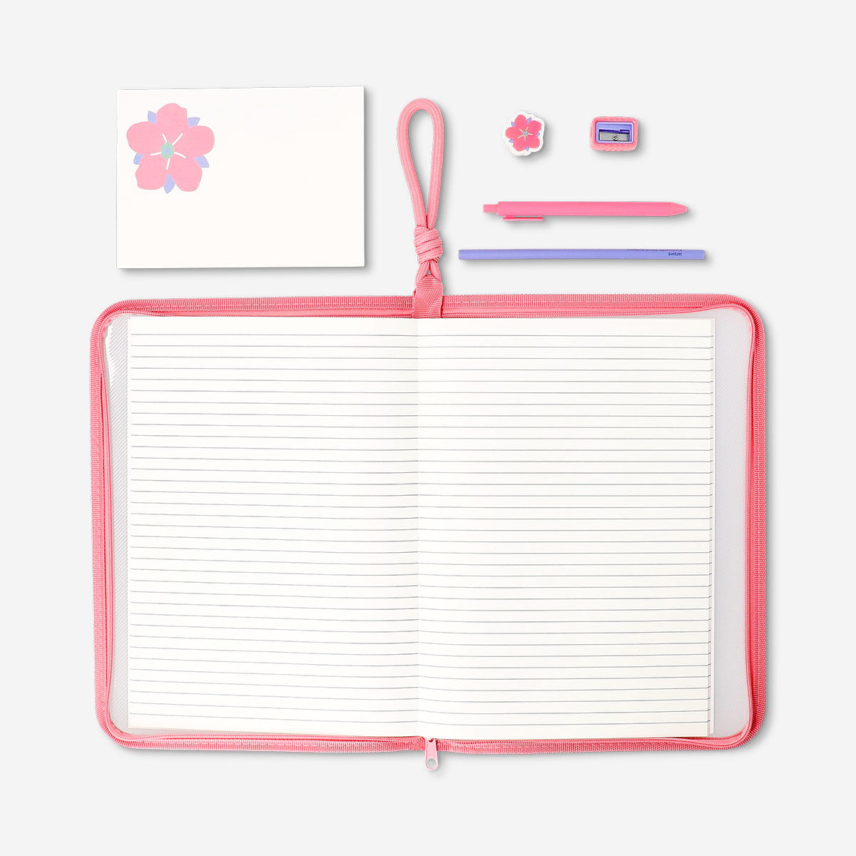 Floral stationery kit from Flying Tiger Copenhagen featuring colorful notepads, pens, and decorative paper for office use.